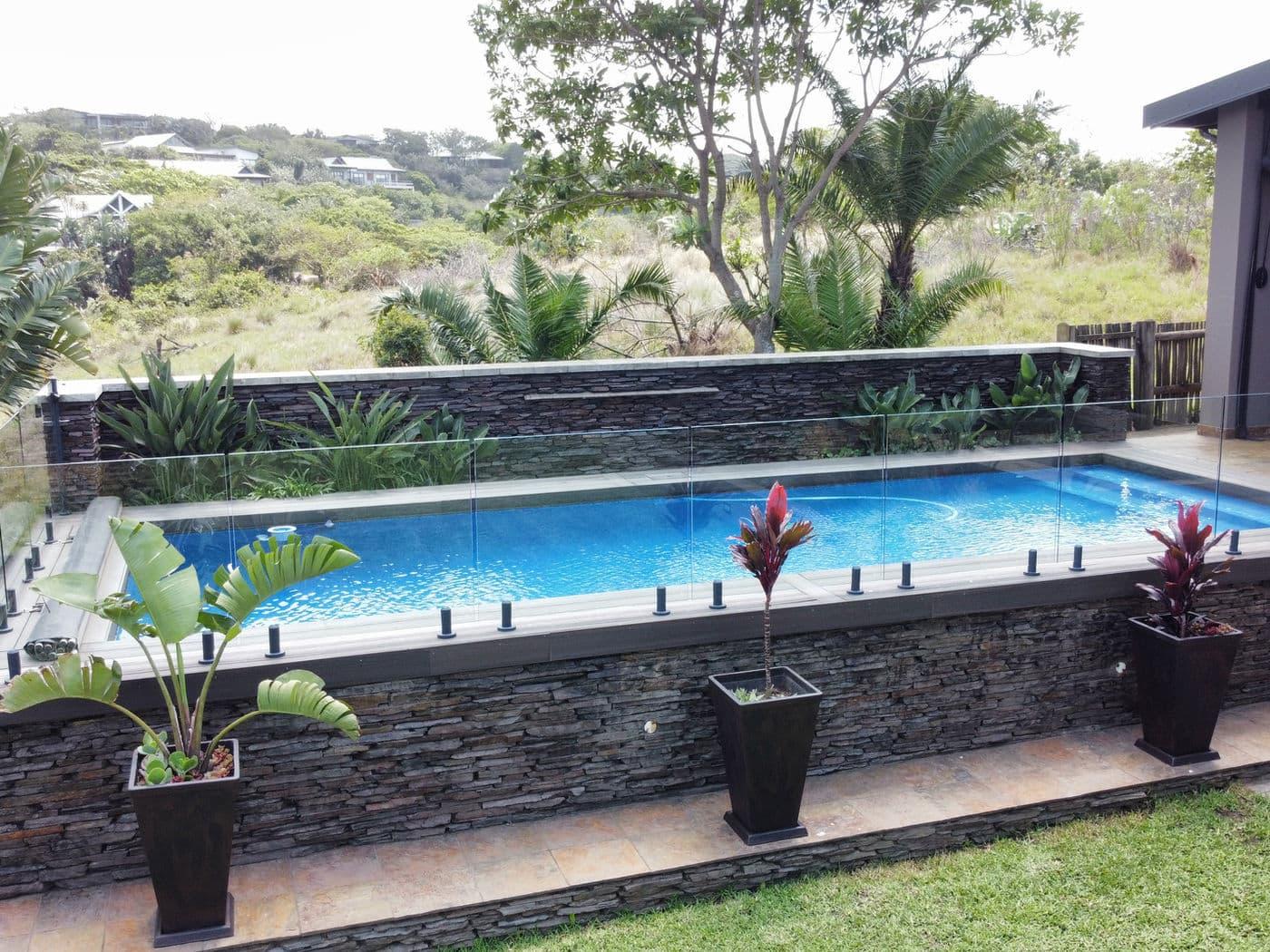 Frameless pool enclosure